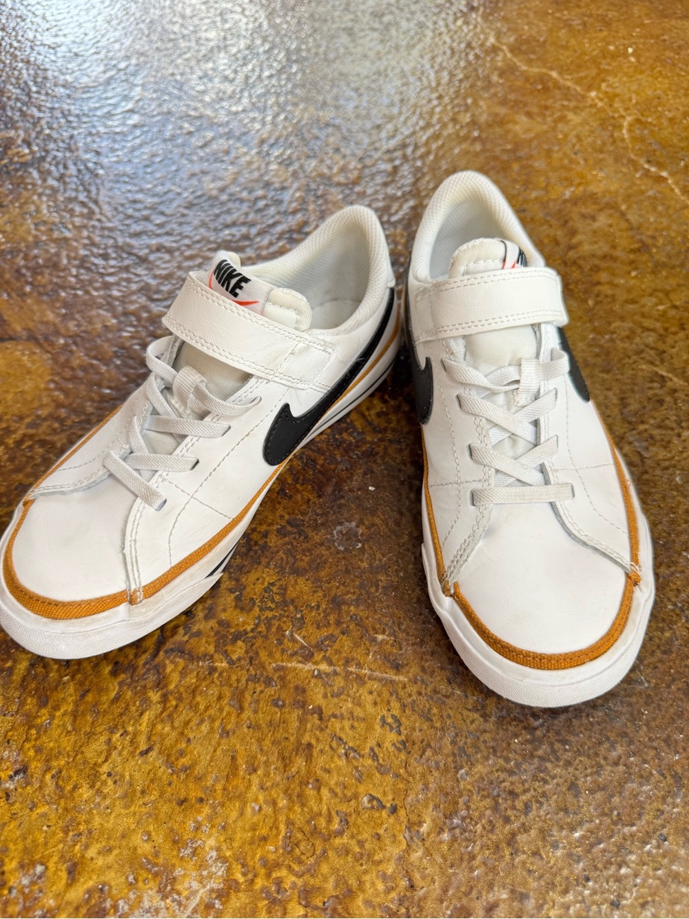 Nike Kids White Sneakers with Black Swoosh and Brown Trim